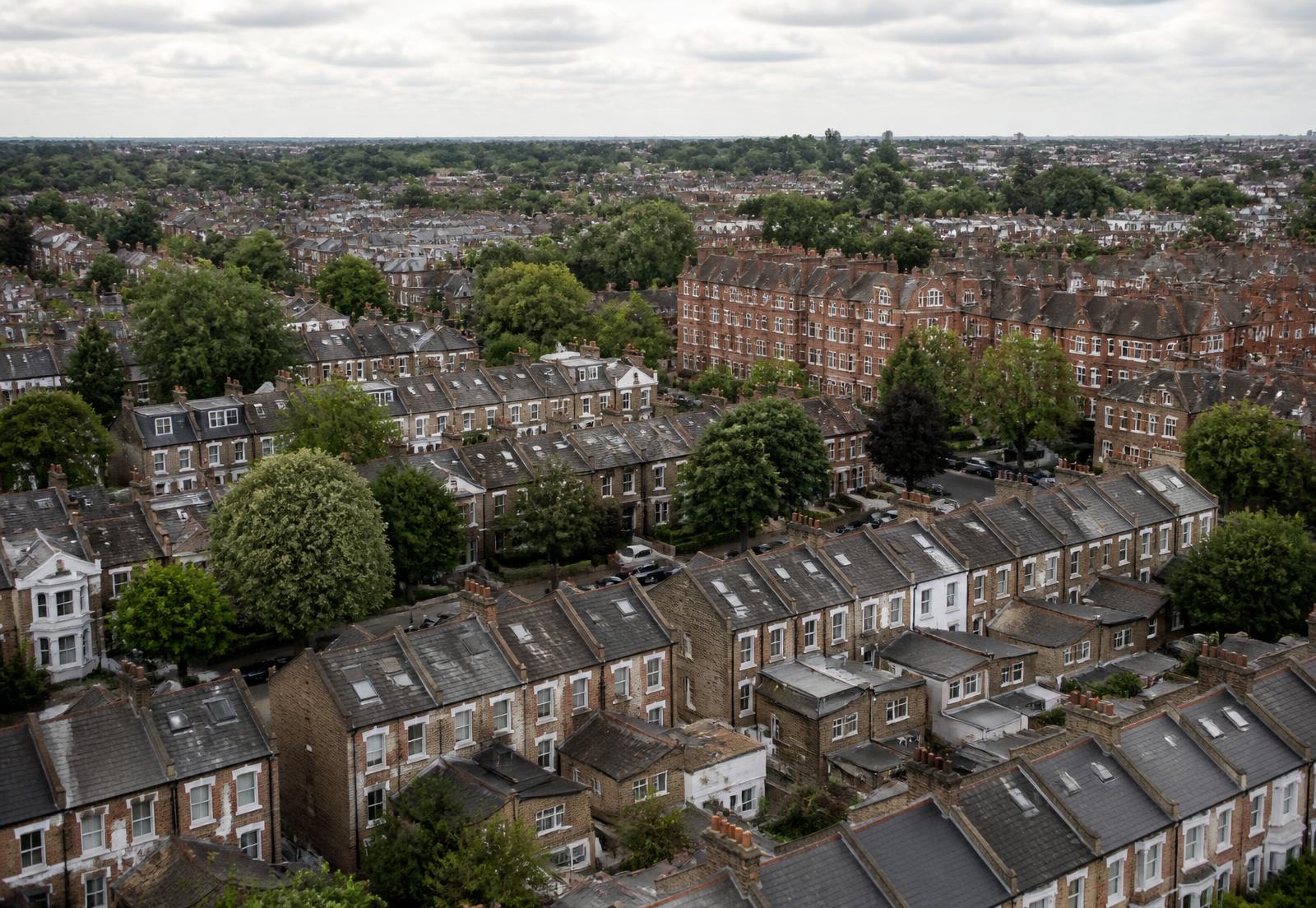 Elevated view across a North London borough of terraced rooftops and mansion blocks